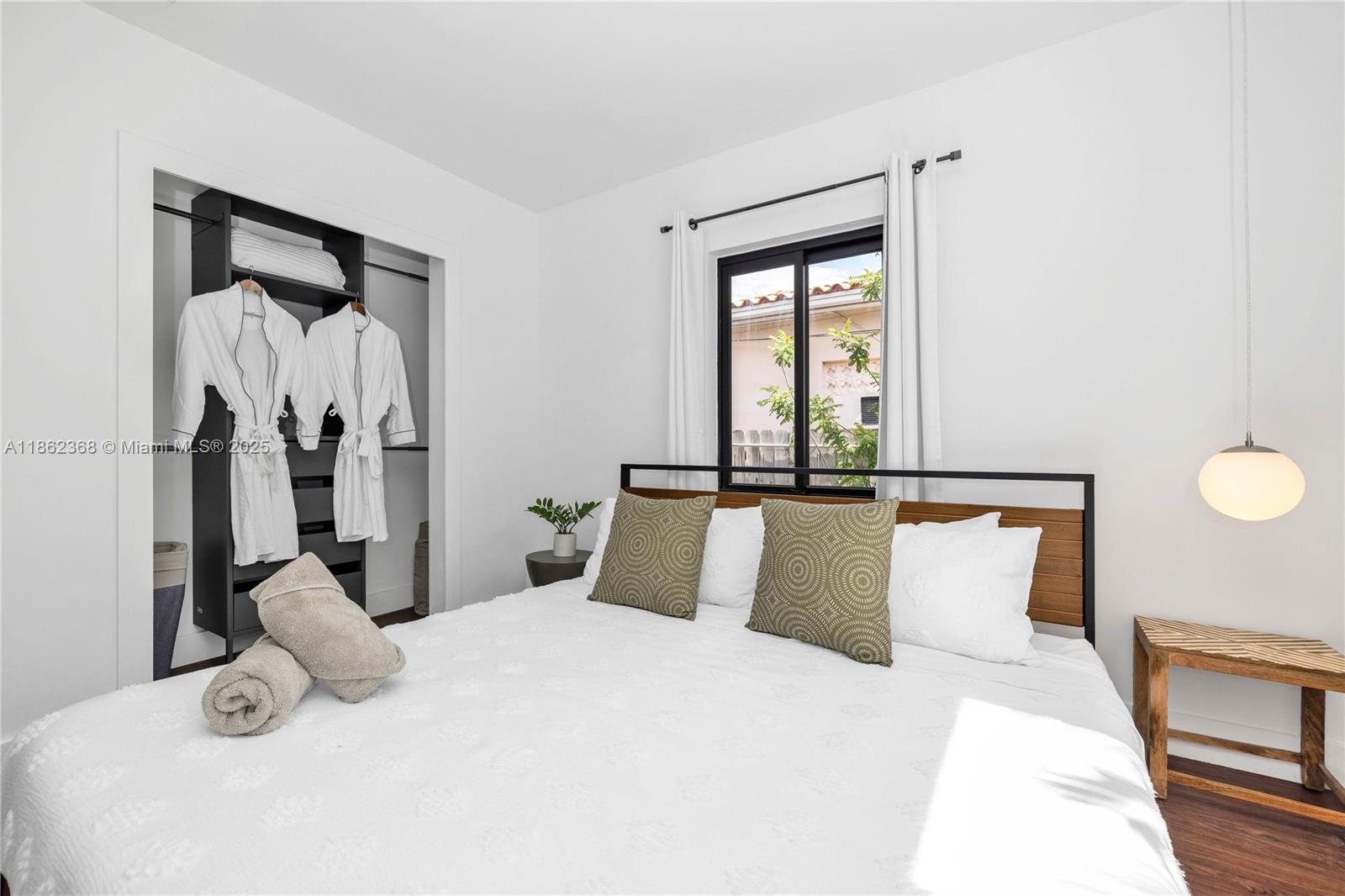 341 Southwest 21st Road Miami, FL 33129 - Photo 17 of 36 a bedroom with a bed and a window