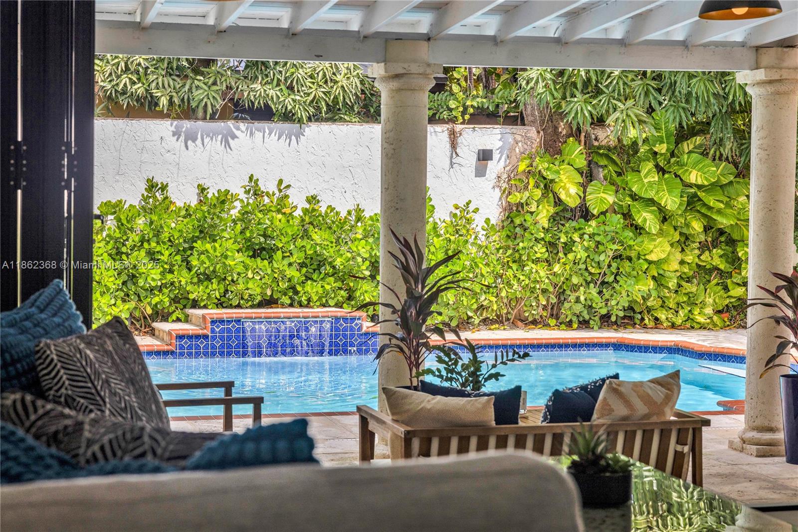 341 Southwest 21st Road Miami, FL 33129 - Photo 3 of 36 a view of a chairs and table in the backyard