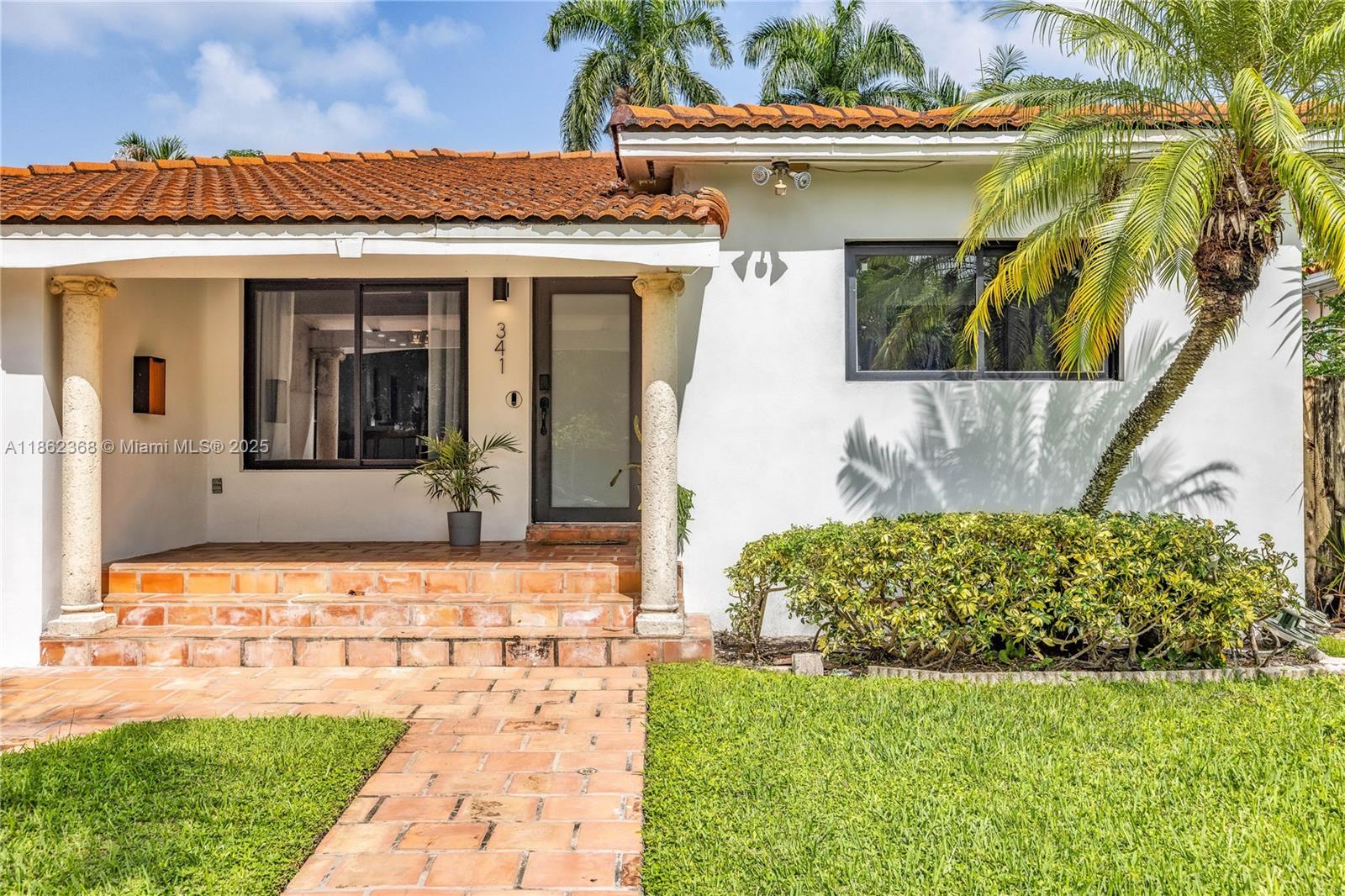 341 Southwest 21st Road Miami, FL 33129 - Photo 34 of 36 a front view of a house with garden