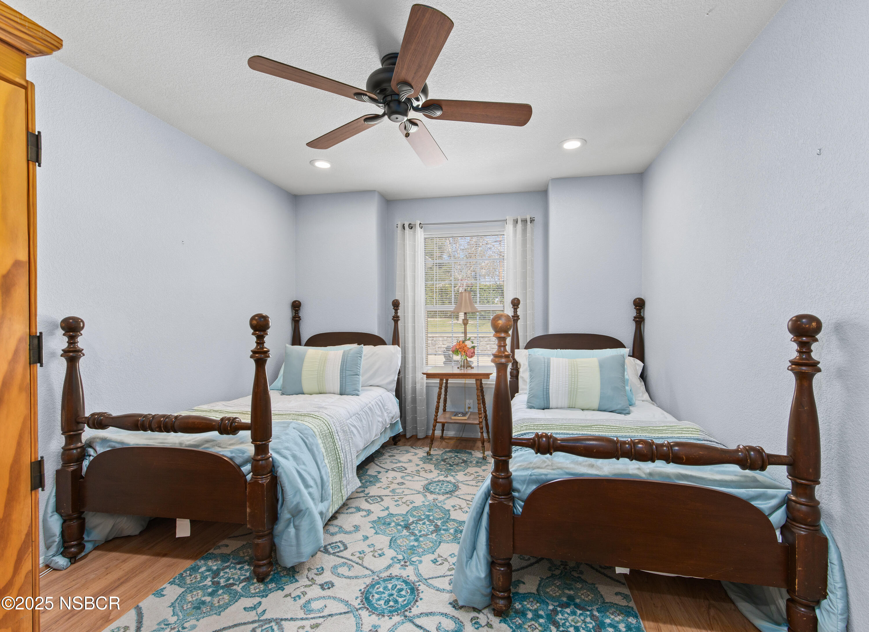 922 College Canyon Road Solvang, CA 93463 - Photo 14 of 23 a bed room with a bed and a chandelier