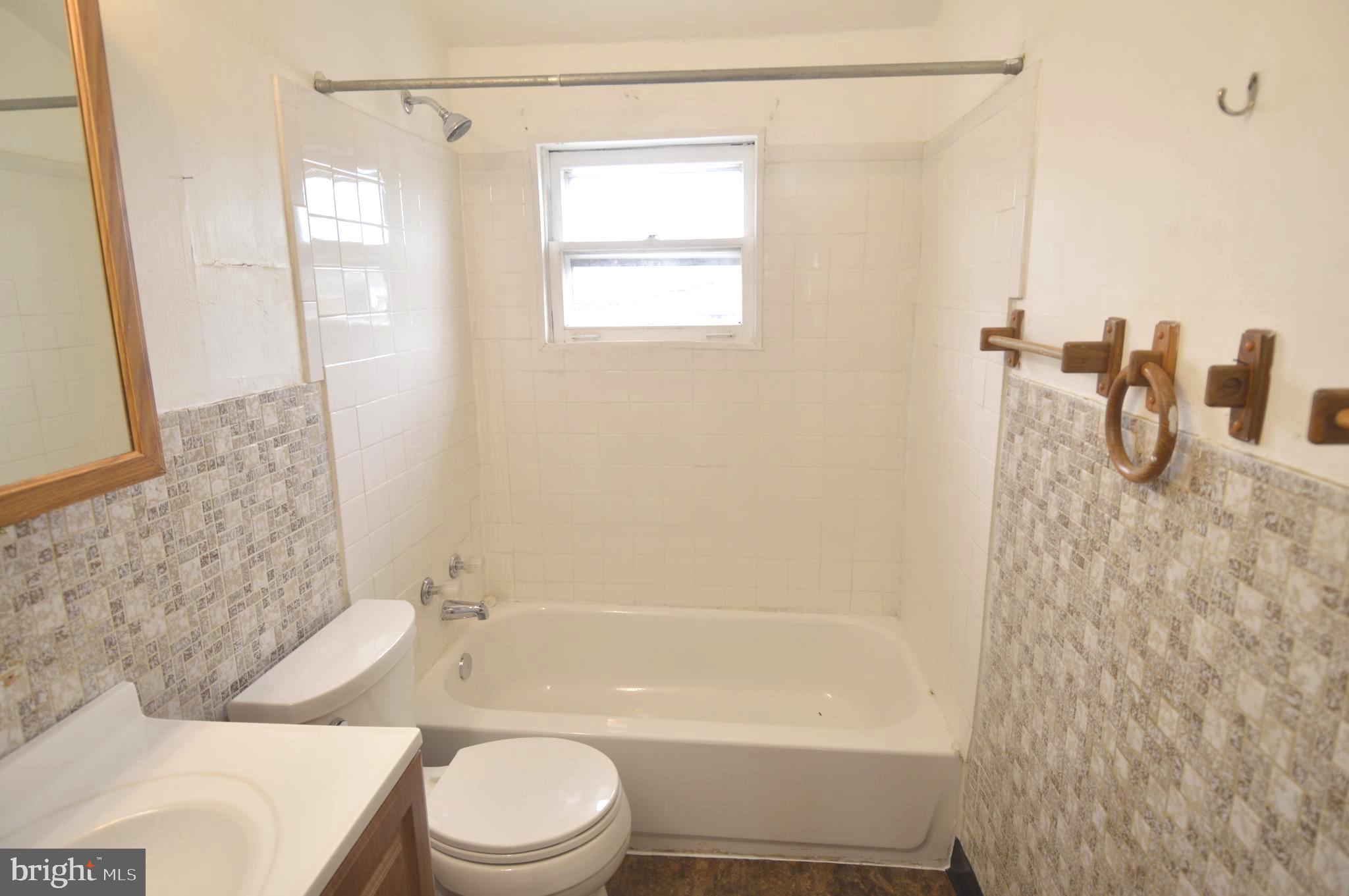 9742 Conmar Road Baltimore, MD 21220 - Photo 11 of 22 a bathroom with a toilet sink and shower