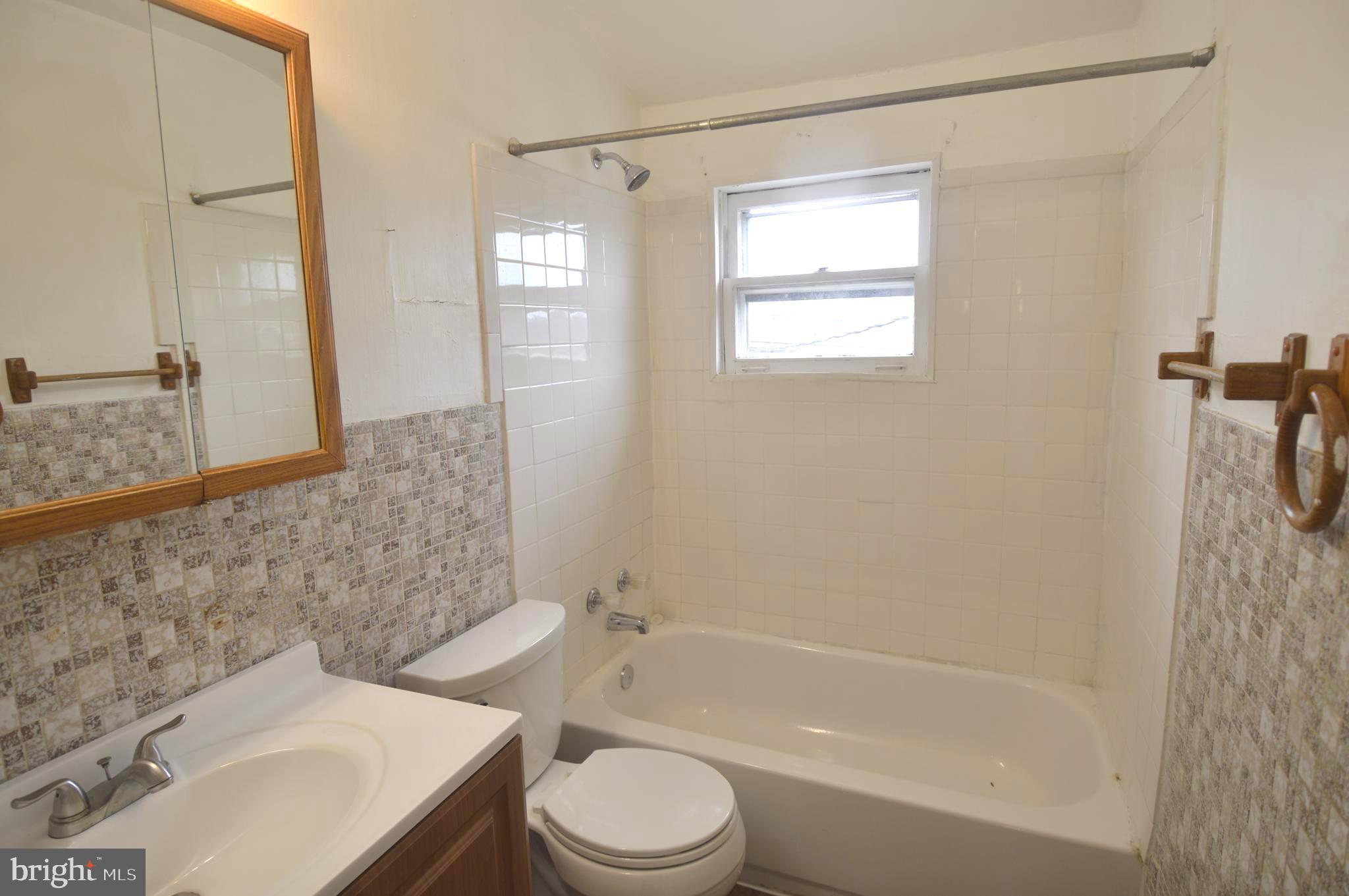 9742 Conmar Road Baltimore, MD 21220 - Photo 12 of 22 a bathroom with a sink toilet and shower