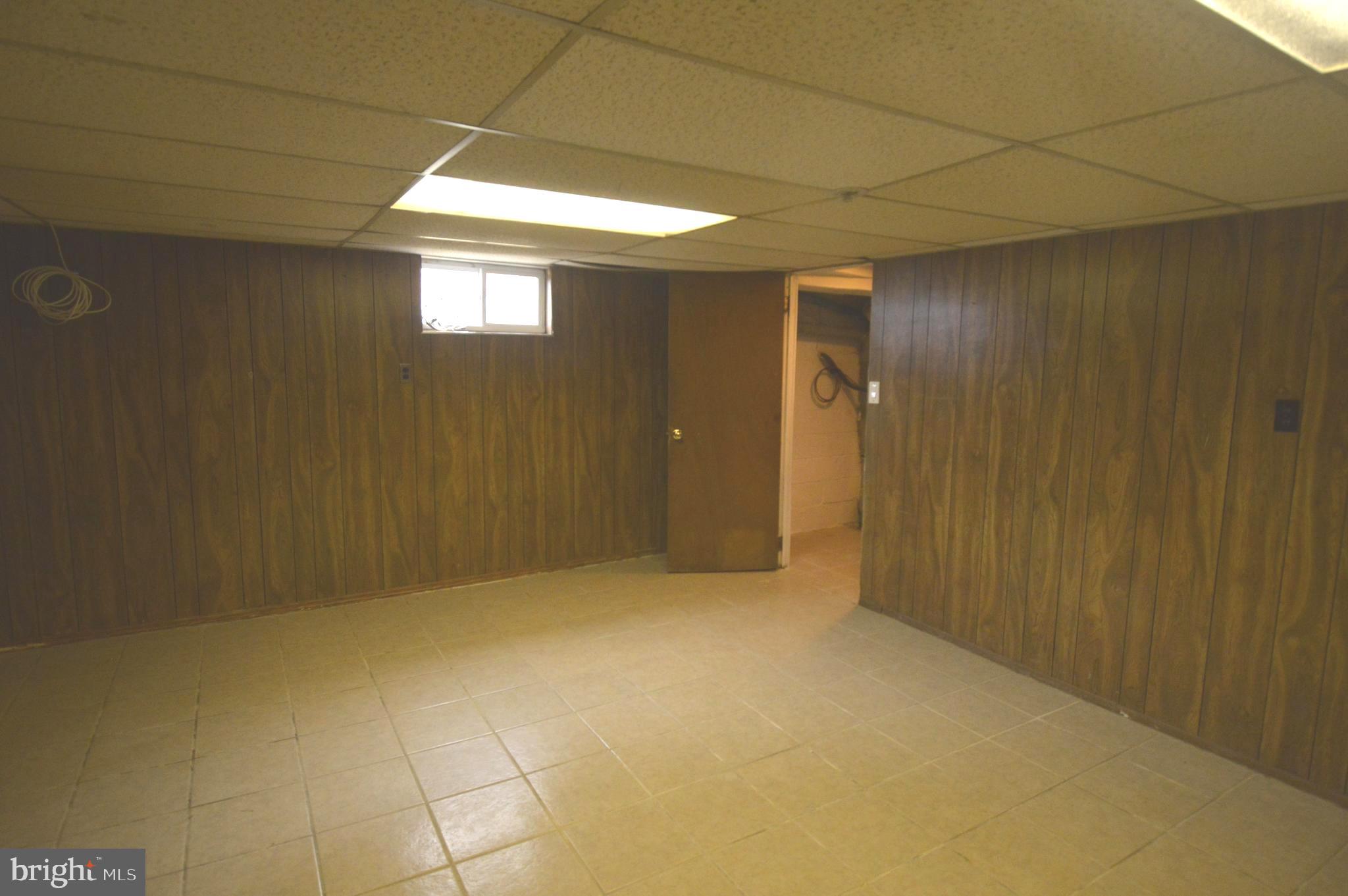 9742 Conmar Road Baltimore, MD 21220 - Photo 16 of 22 a view of an empty room and window