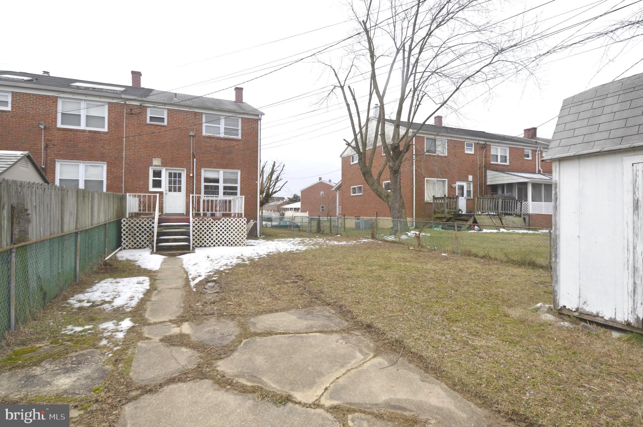 9742 Conmar Road Baltimore, MD 21220 - Photo 17 of 22 a view of a building with a yard