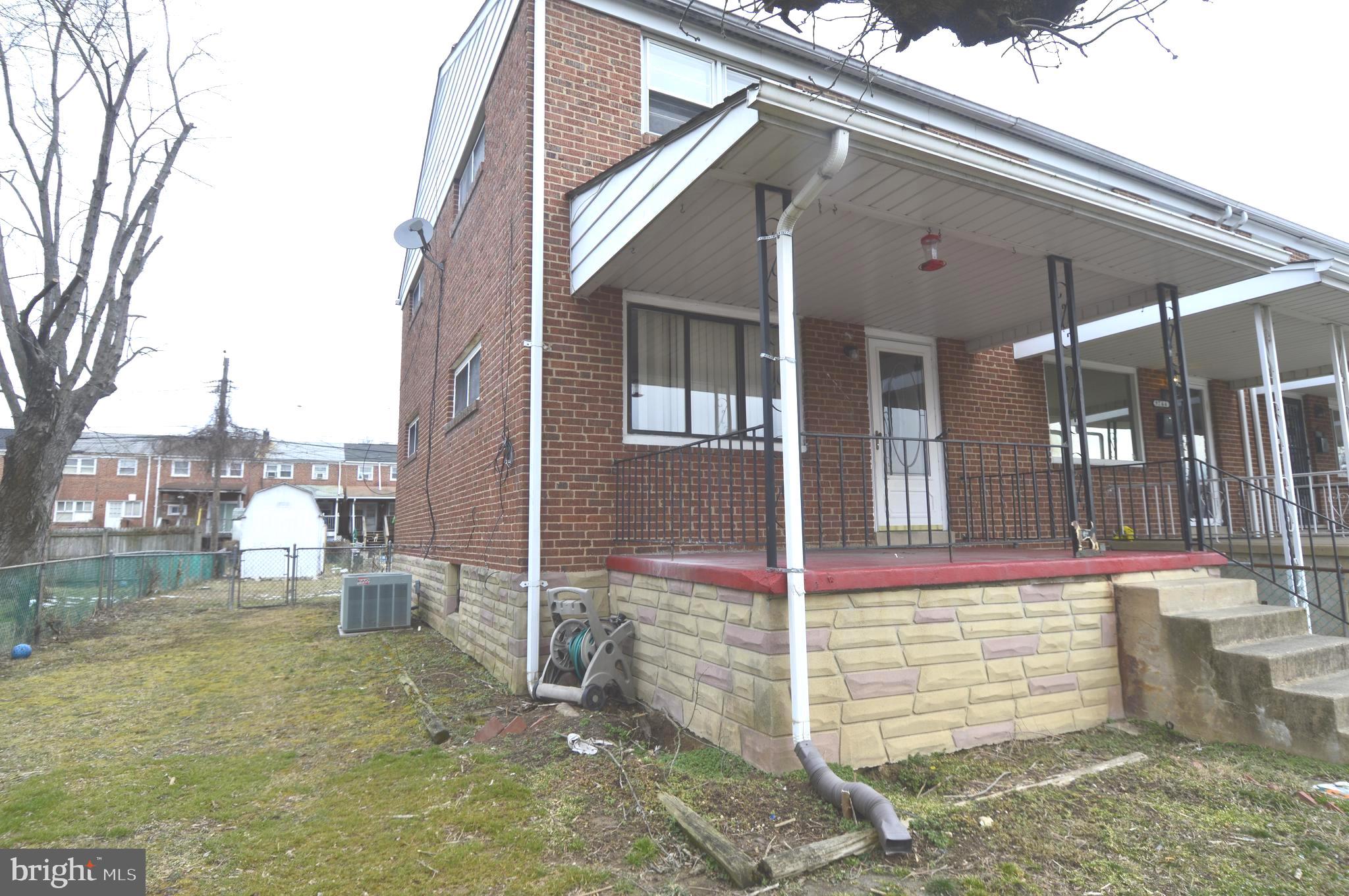 9742 Conmar Road Baltimore, MD 21220 - Photo 21 of 22 a front view of a house with a yard