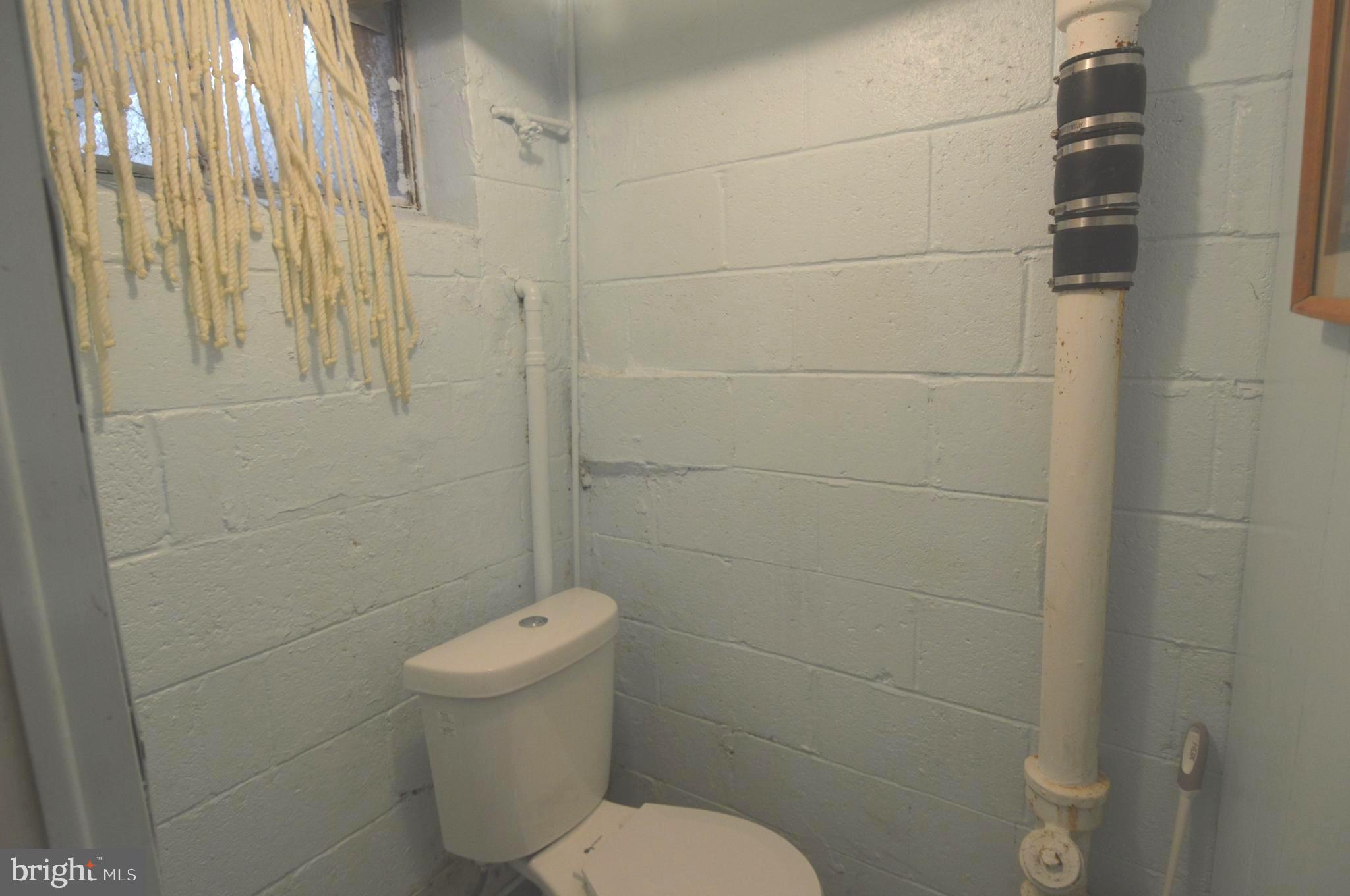 9742 Conmar Road Baltimore, MD 21220 - Photo 22 of 22 a bathroom with a toilet and a shower