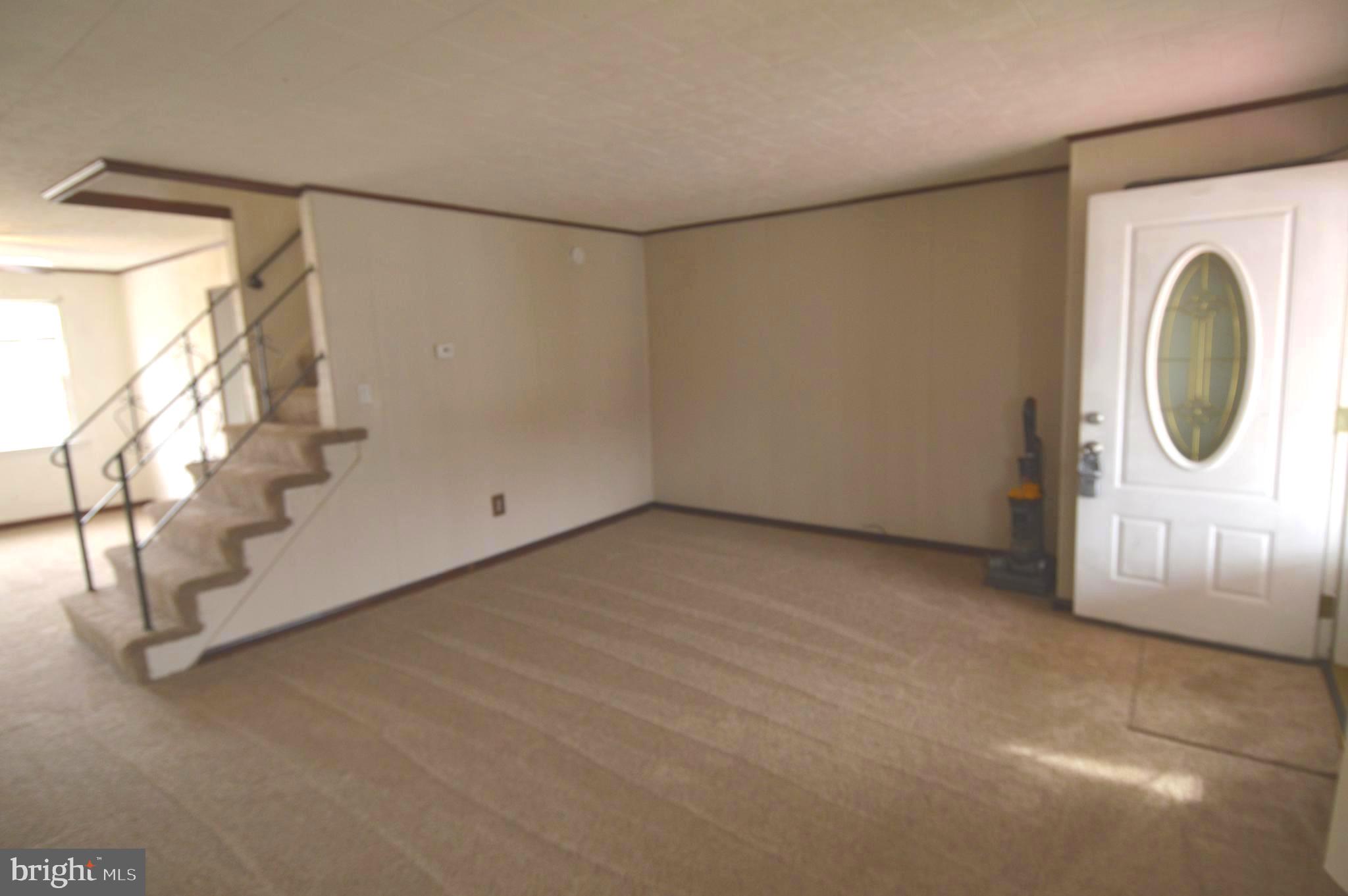 9742 Conmar Road Baltimore, MD 21220 - Photo 4 of 22 a view of a room with wooden floor and windows