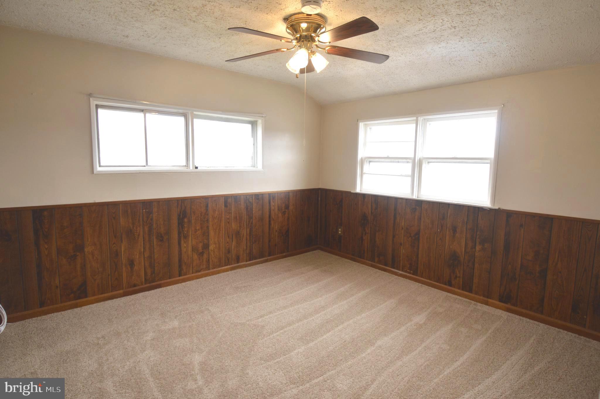 9742 Conmar Road Baltimore, MD 21220 - Photo 9 of 22 a view of an empty room with a window