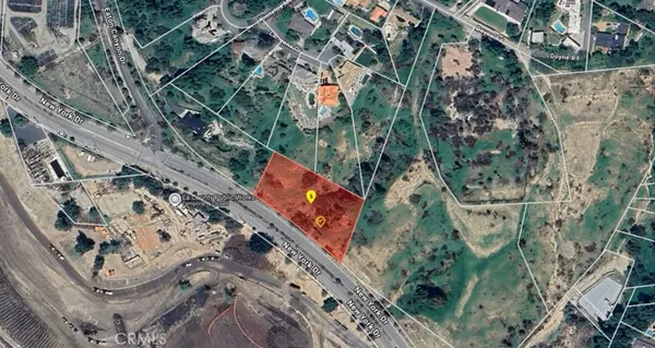 an aerial view of a residential houses with outdoor space