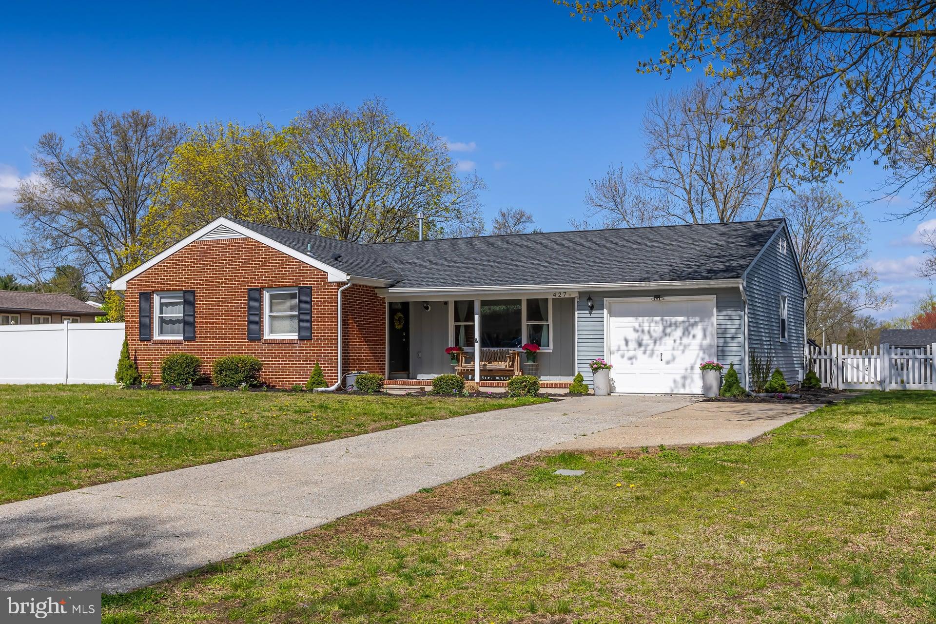 427 Birch Drive Mickleton, NJ 08056 - Photo 25 of 26 a front view of a house with a yard and garage