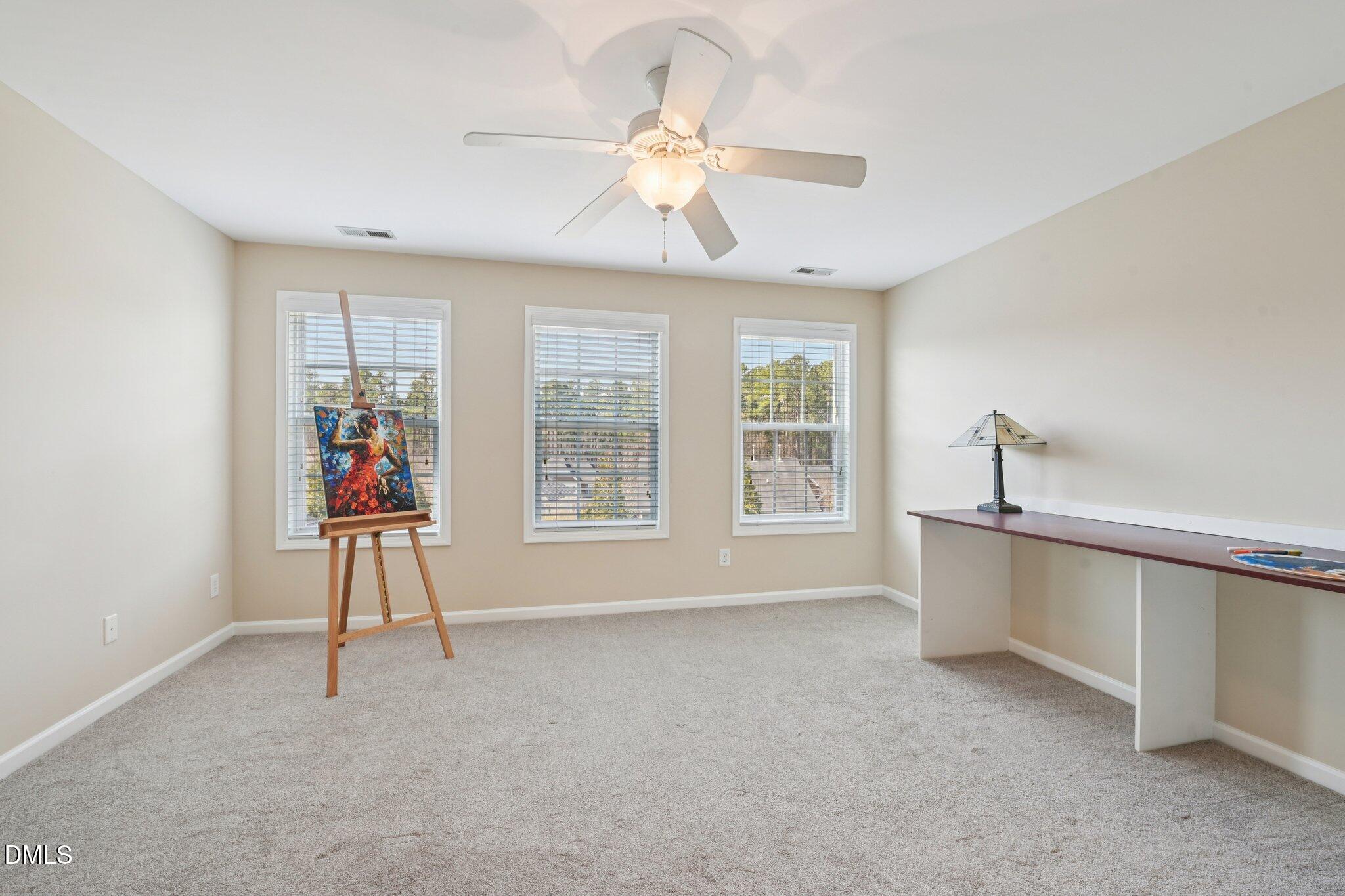 11 Hidden Ridge Court Durham, NC 27707 - Photo 20 of 30 a view of an empty room with a window