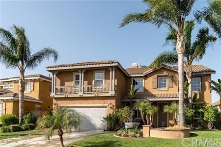 13994 Kassell Road Eastvale, CA 92880 - Photo 1 of 1 a front view of a house with garden