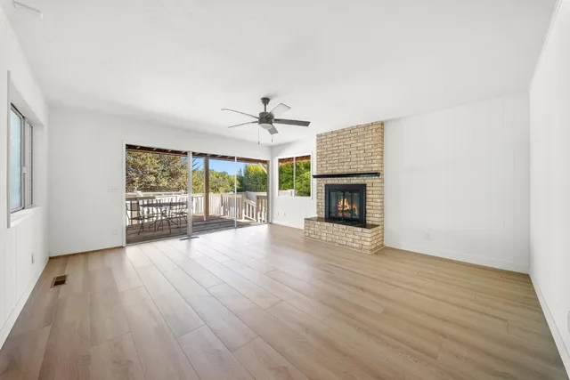 a dining room with furniture window and wooden floor