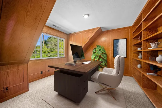 a bedroom with a bed and a fireplace