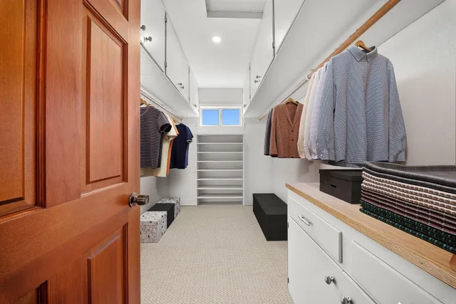 a bathroom with a tub a sink and a shower