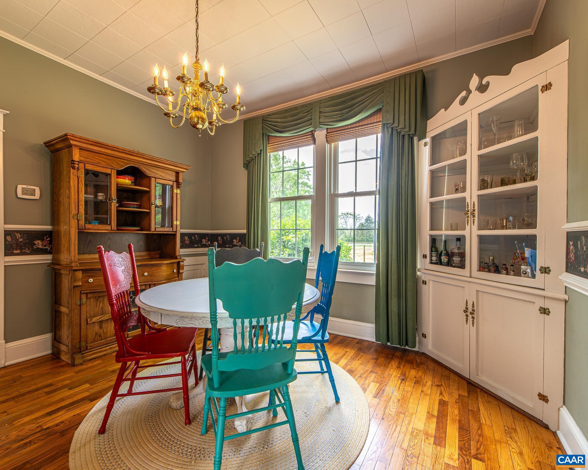 12500 Shannon Hill Road Louisa, VA 23093 - Photo 15 of 59 a view of a dining room with furniture window and wooden floor
