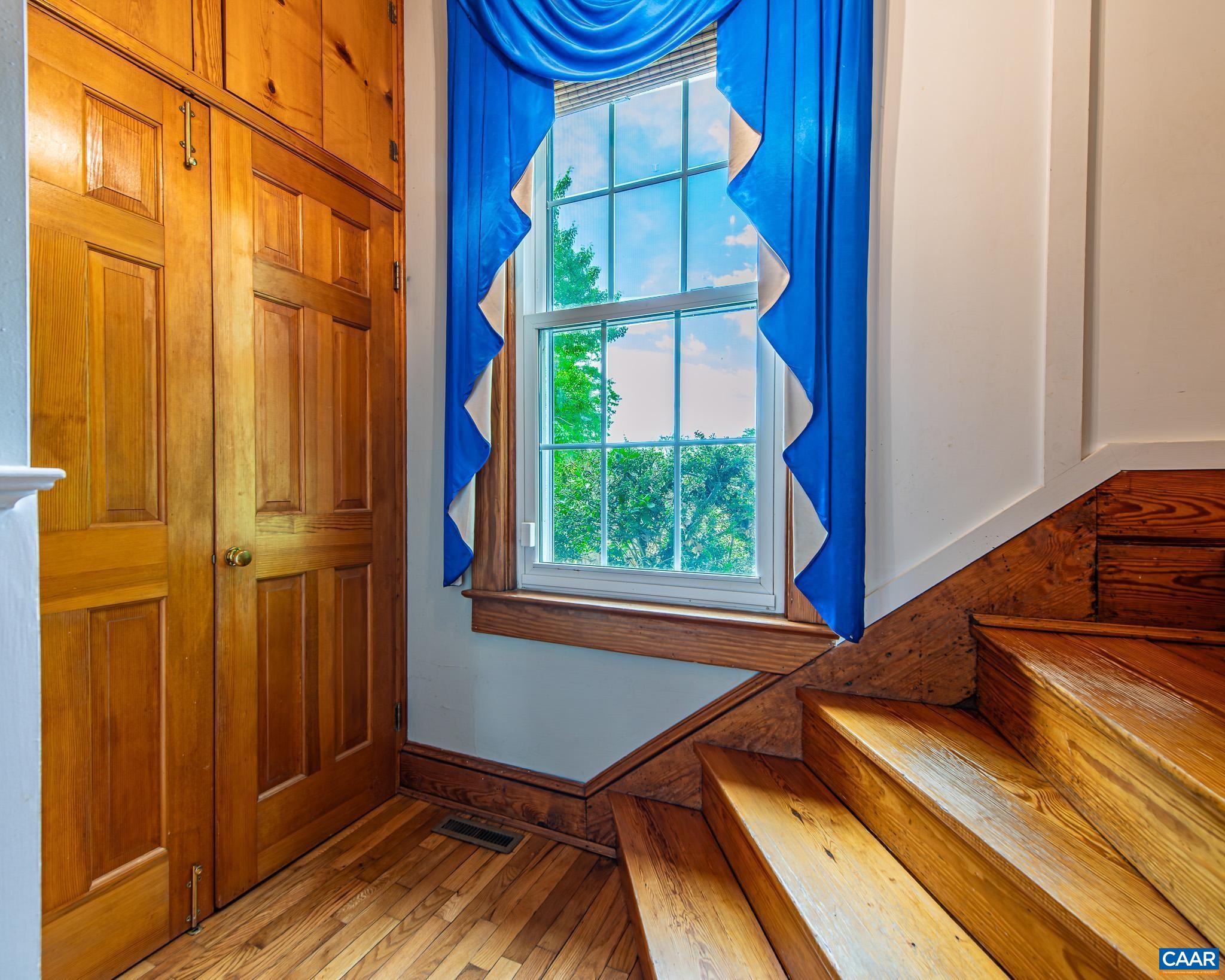 12500 Shannon Hill Road Louisa, VA 23093 - Photo 20 of 59 a view of a balcony with chair and windows