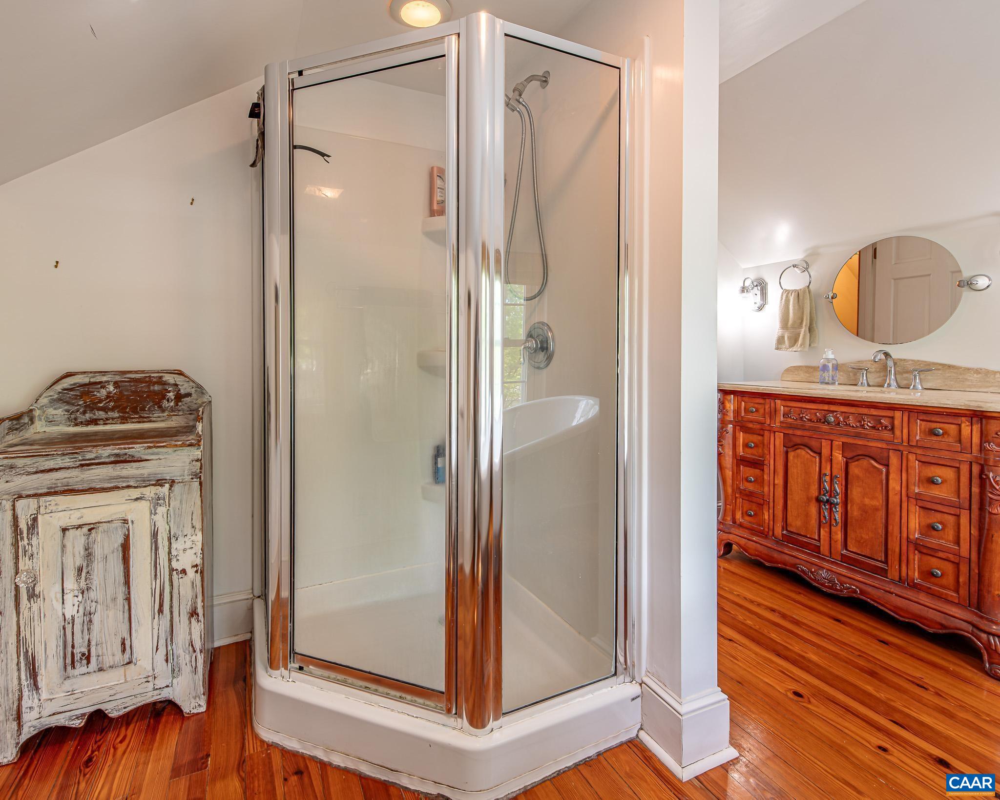 12500 Shannon Hill Road Louisa, VA 23093 - Photo 25 of 59 a bathroom with a tub and shower view
