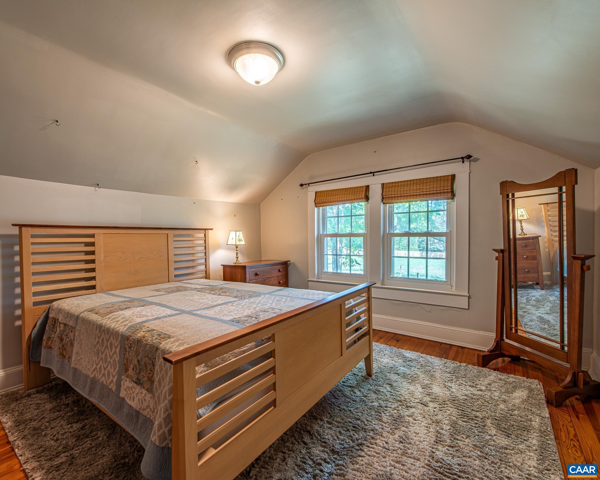 12500 Shannon Hill Road Louisa, VA 23093 - Photo 28 of 59 a spacious bedroom with a bed and a window