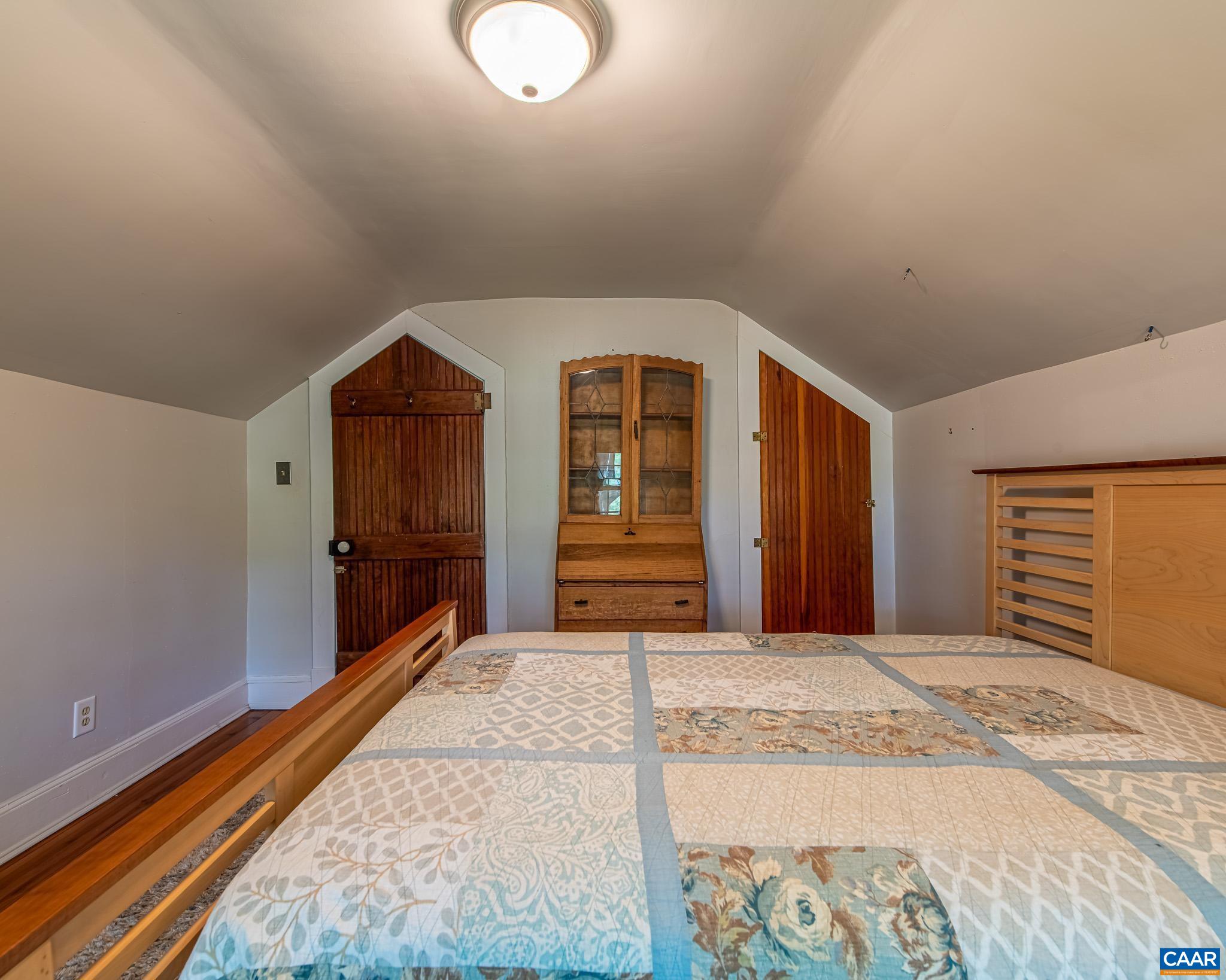 12500 Shannon Hill Road Louisa, VA 23093 - Photo 29 of 59 a bedroom with a bed and a dresser