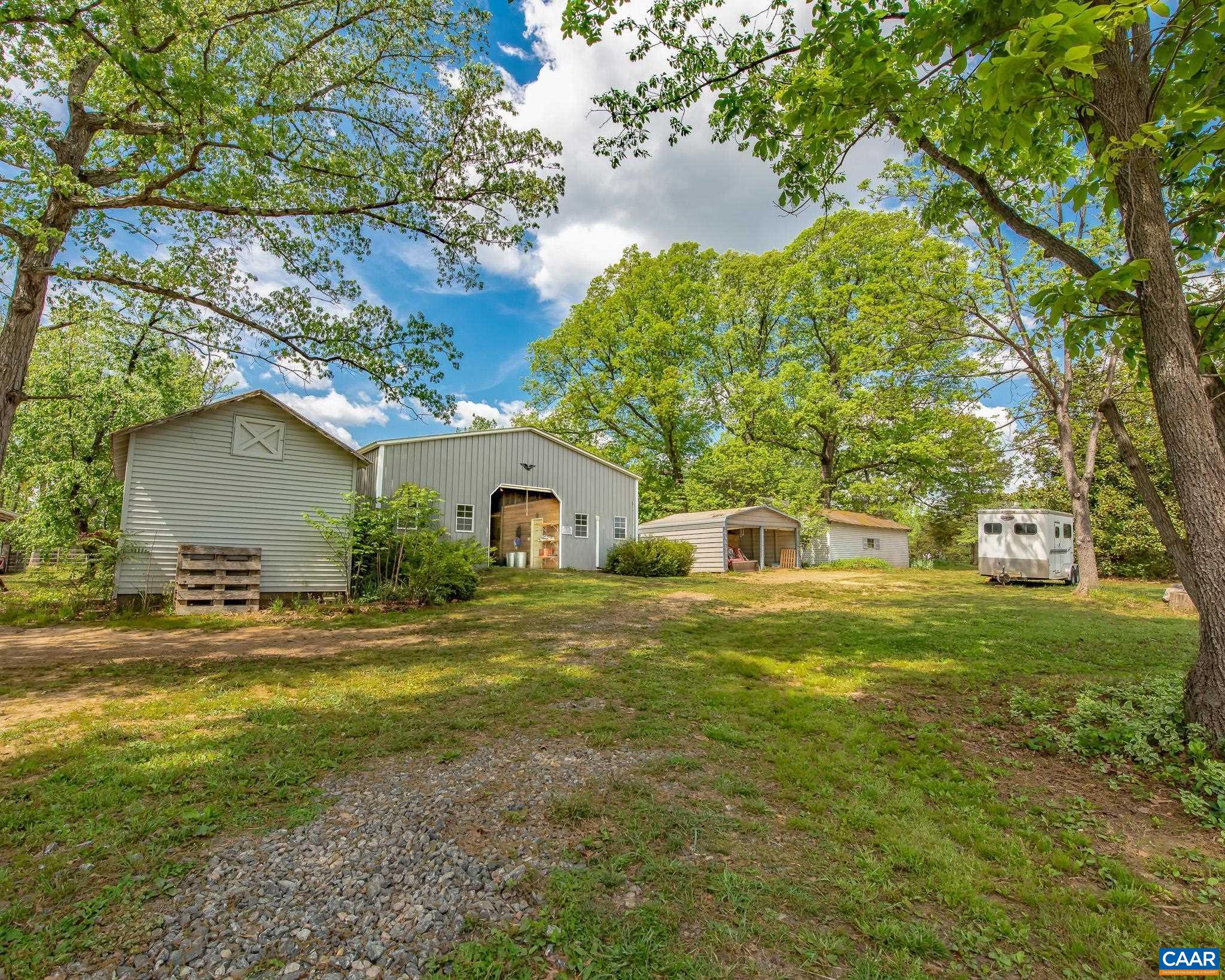12500 Shannon Hill Road Louisa, VA 23093 - Photo 8 of 59 a front view of a house with a yard
