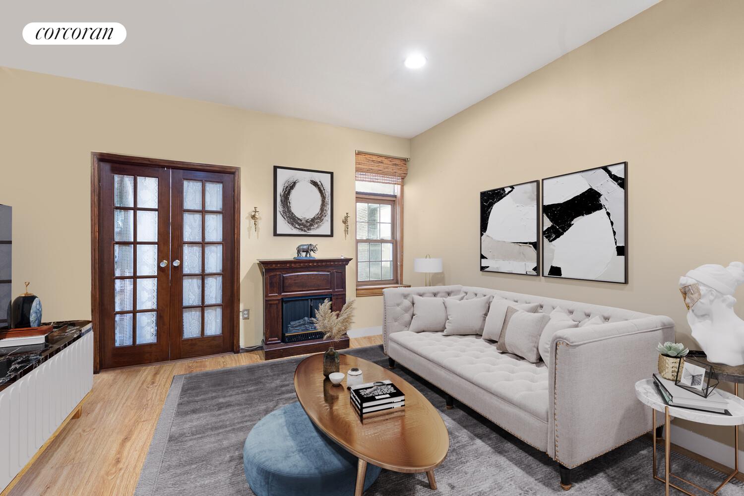 a living room with furniture and a fireplace