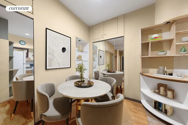 a bedroom with furniture and a large window