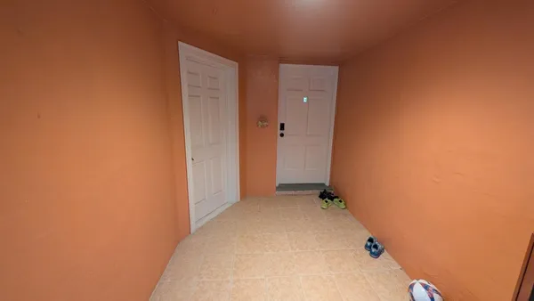a kitchen with a refrigerator sink and cabinets