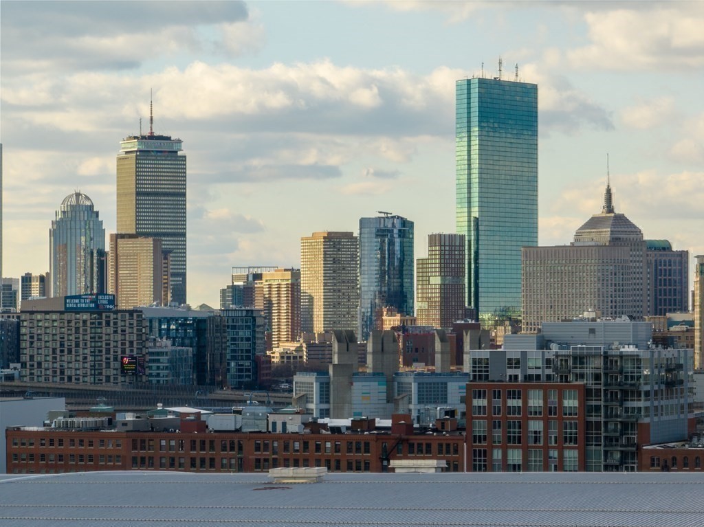 437 D Street, Unit 6A Boston, MA 02210 - Photo 25 of 26 a city skyline with tall buildings