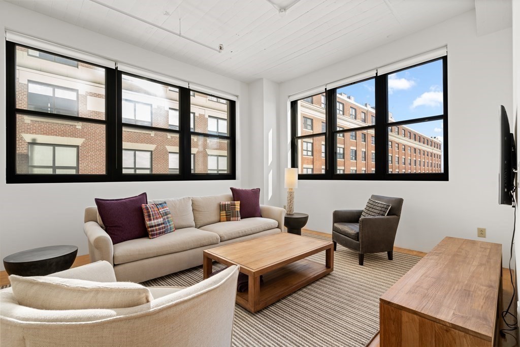 437 D Street, Unit 6A Boston, MA 02210 - Photo 3 of 26 a living room with furniture and a window