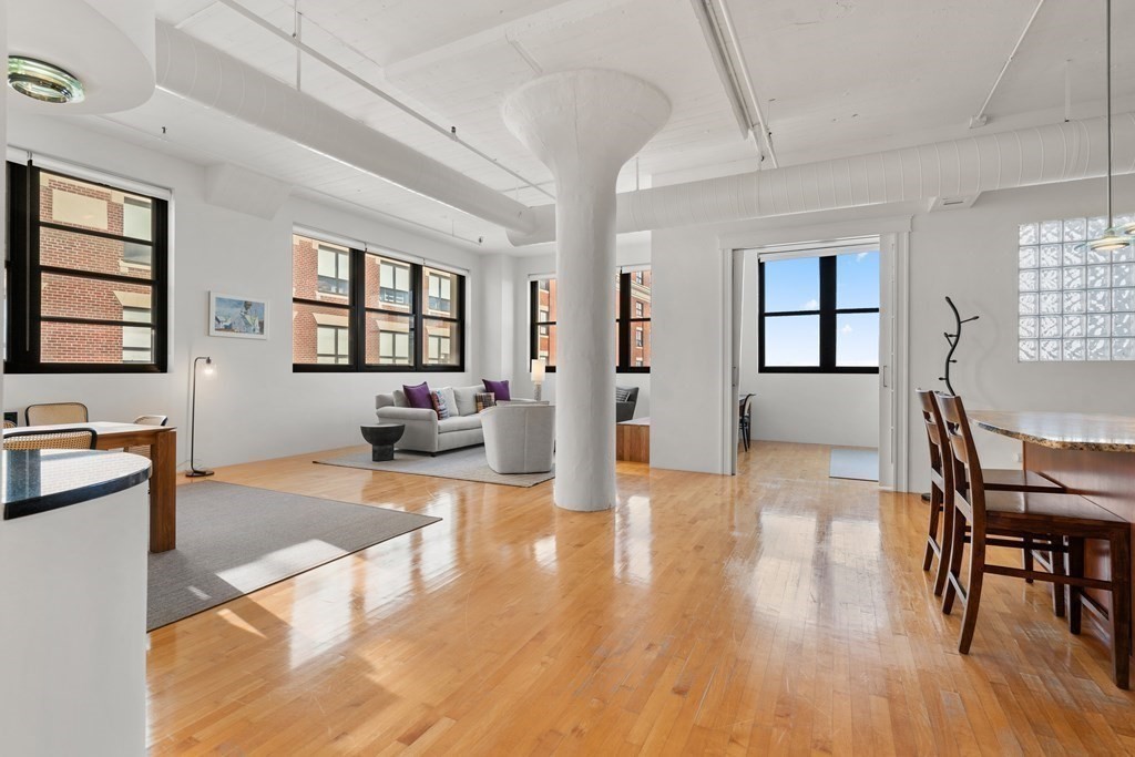 437 D Street, Unit 6A Boston, MA 02210 - Photo 6 of 26 a living room with furniture and a wooden floor