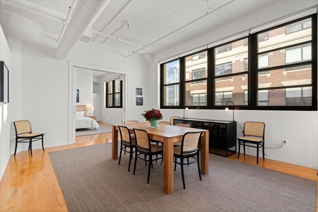 437 D Street, Unit 6A Boston, MA 02210 - Photo 7 of 26 a view of a dining room with furniture and wooden floor