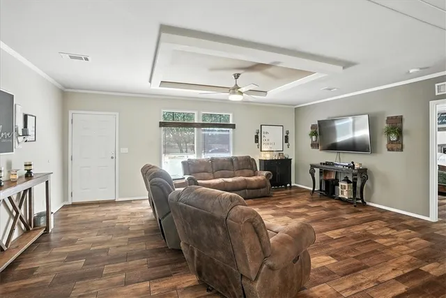 a bedroom with furniture and a flat screen tv