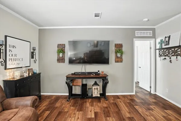 a living room with a couch and a flat screen tv