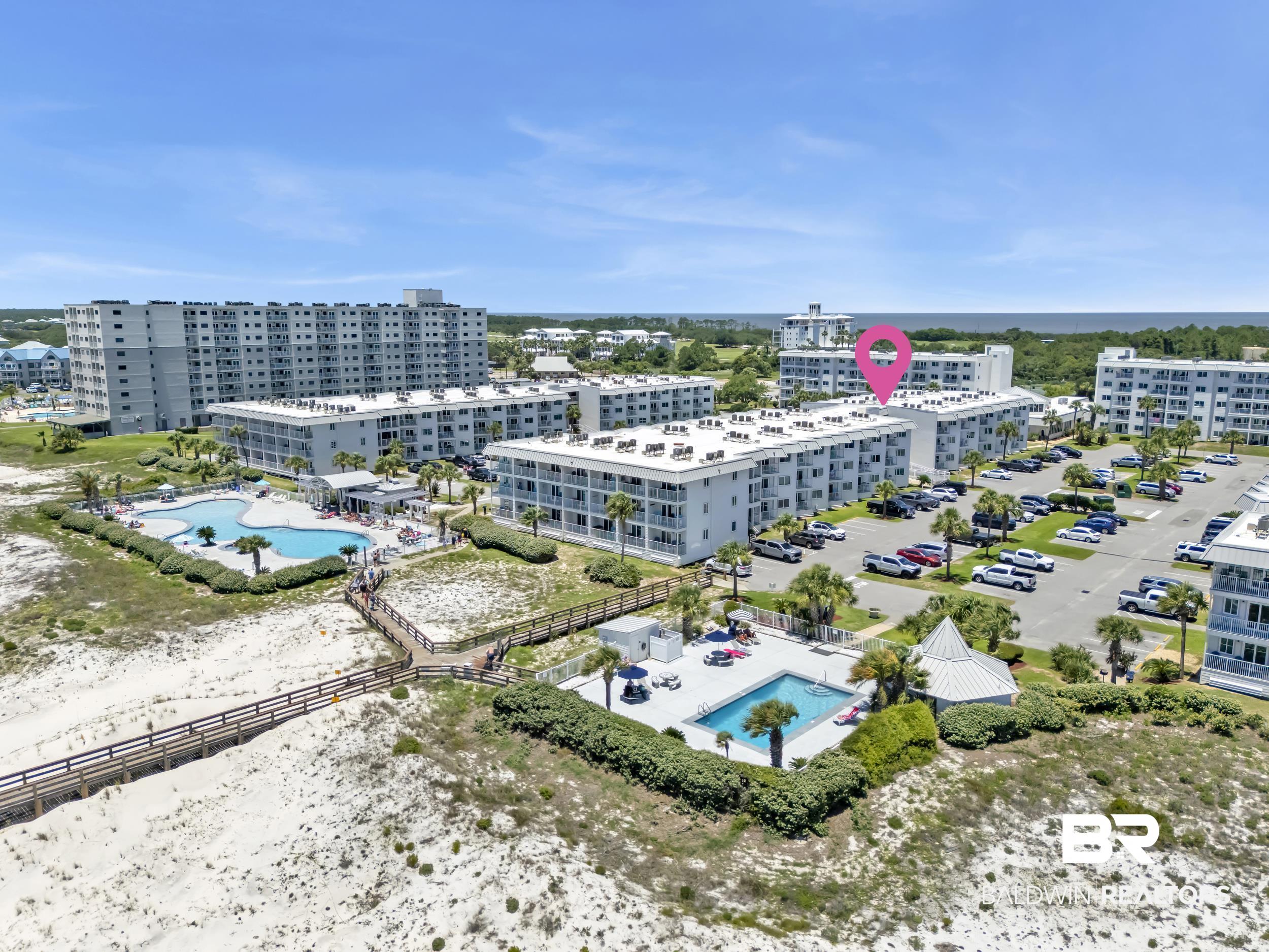400 Plantation Road, Unit 2118 Gulf Shores, AL 36542 - Photo 47 of 59 Coastal condominium complex featuring multiple buildings, multiple pools, and a boardwalk to the beach