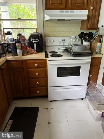 a view of a kitchen with appliances and cabinets