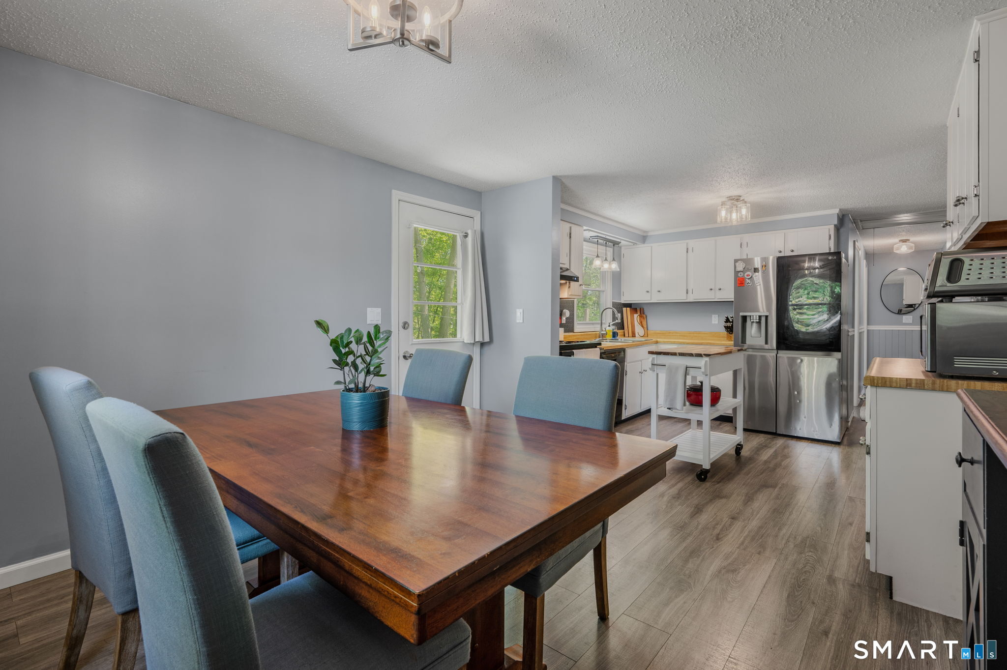 6 Amherst Court Groton, CT 06355 - Photo 13 of 40 a view of a dining room with furniture and a potted plant