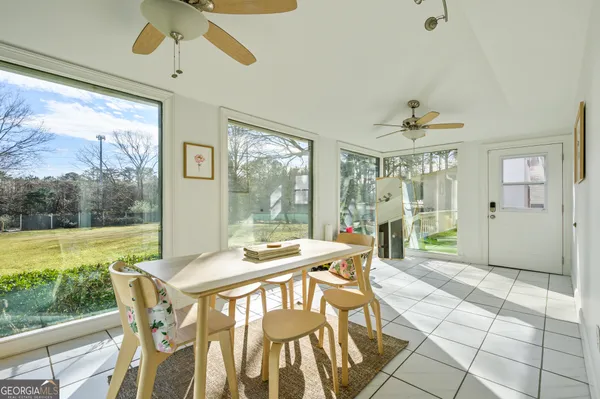 a view of a dining room with furniture window and outside view