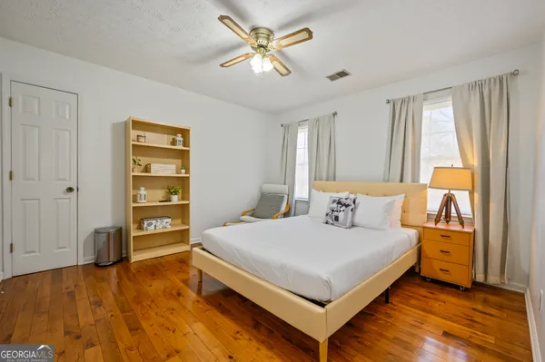 a bedroom with a bed and a cabinets