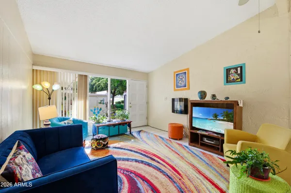 a living room with furniture and a window