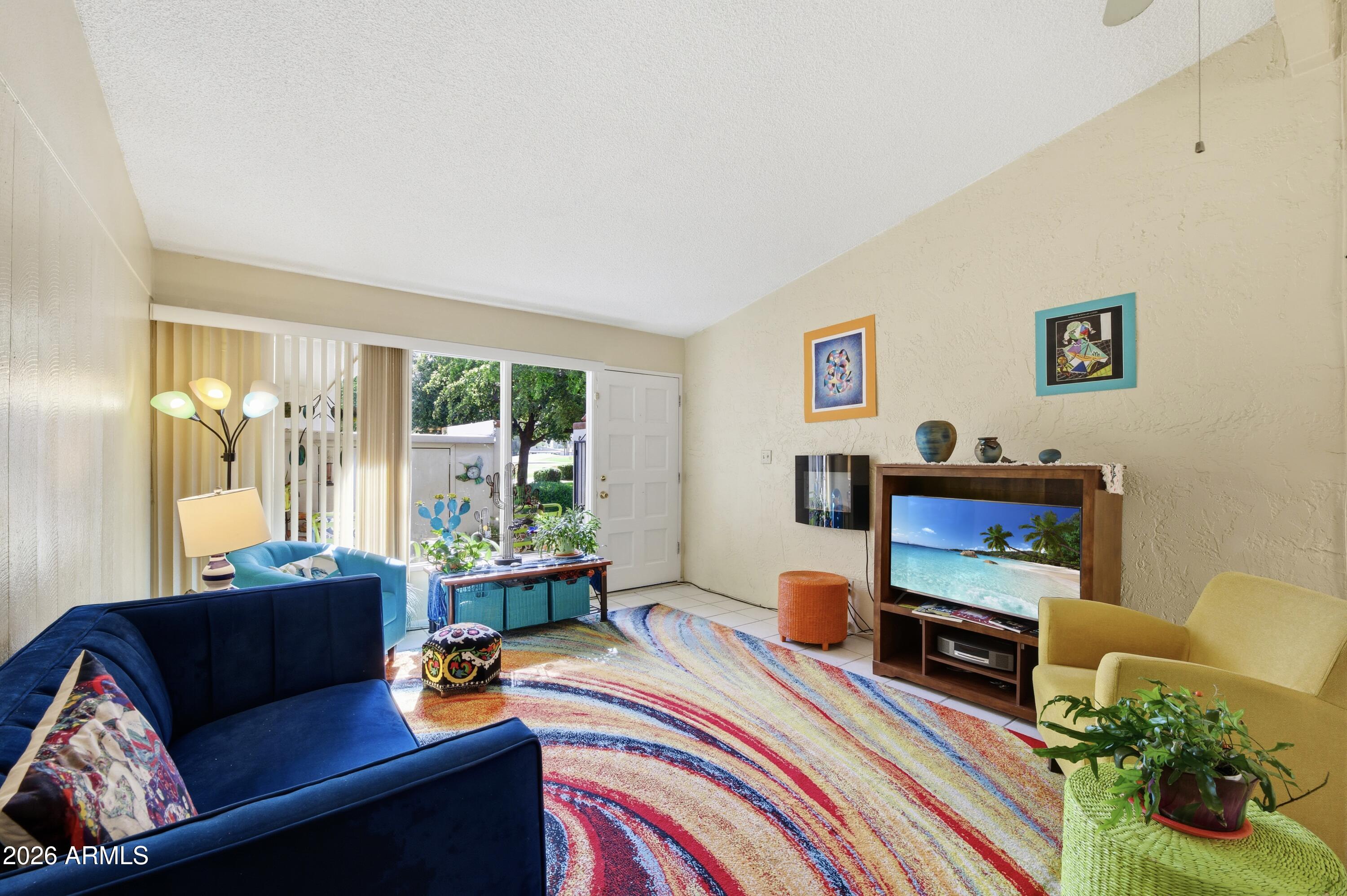 a living room with furniture and a window