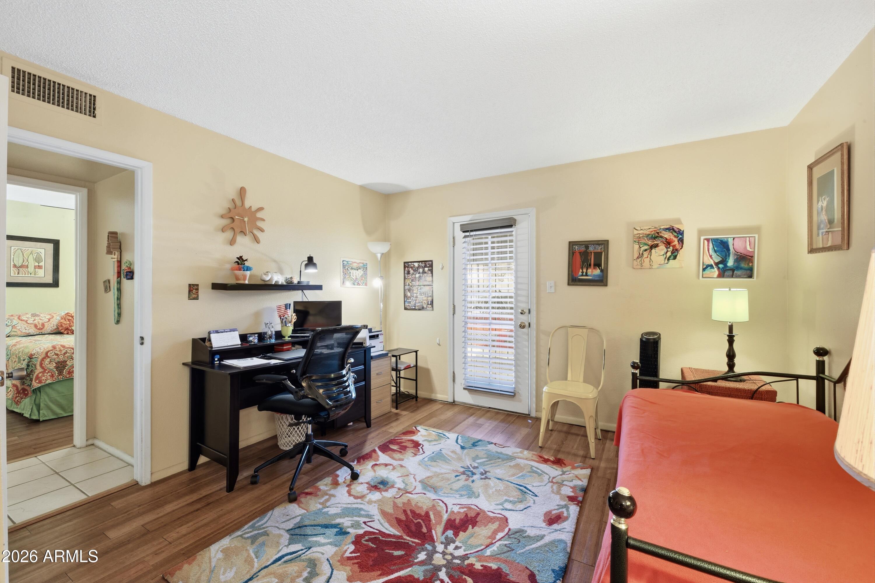641 South Power Road, Unit 366 Mesa, AZ 85206 - Photo 12 of 22 a living room with furniture and a flat screen tv