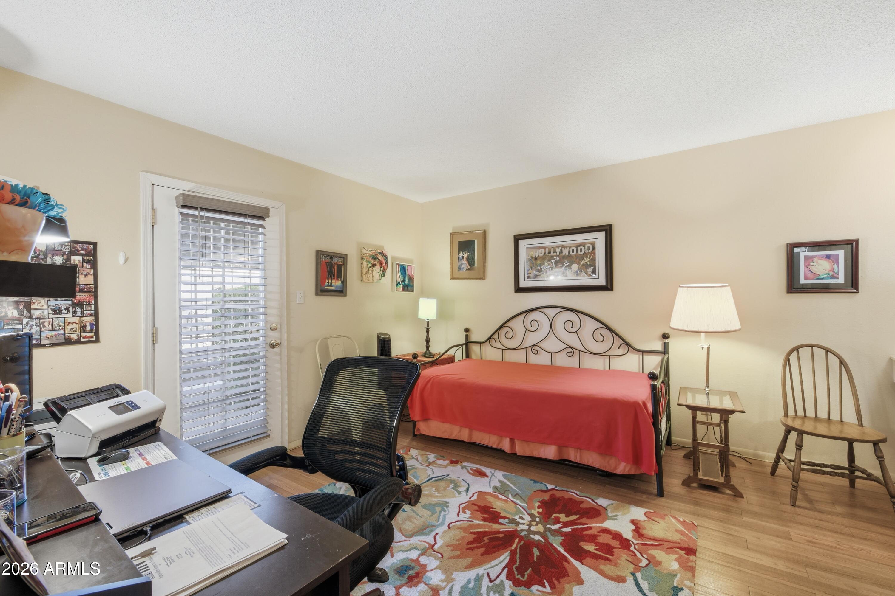 641 South Power Road, Unit 366 Mesa, AZ 85206 - Photo 7 of 22 a bedroom with furniture and a window
