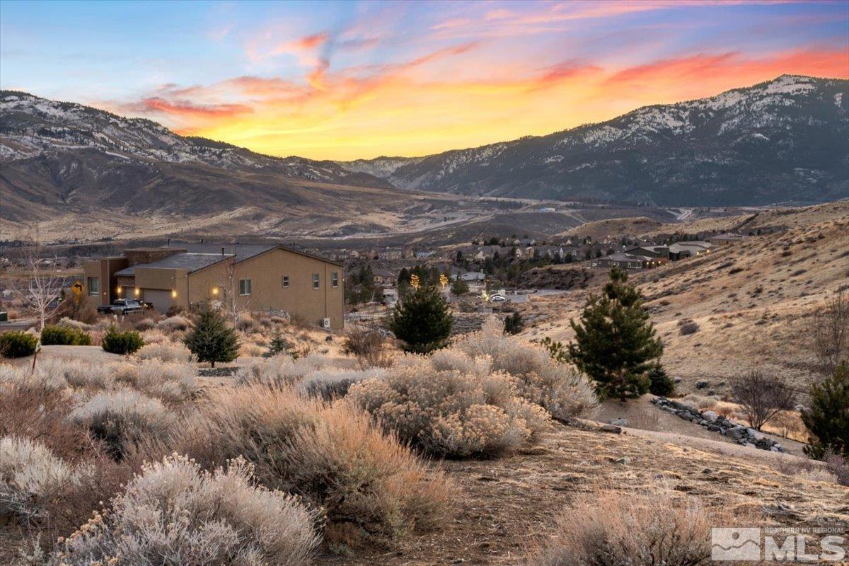 8673 Eagle Chase Trail, Unit 444 Reno, NV 89523 - Photo 9 of 14 a view of a house with a mountain yard