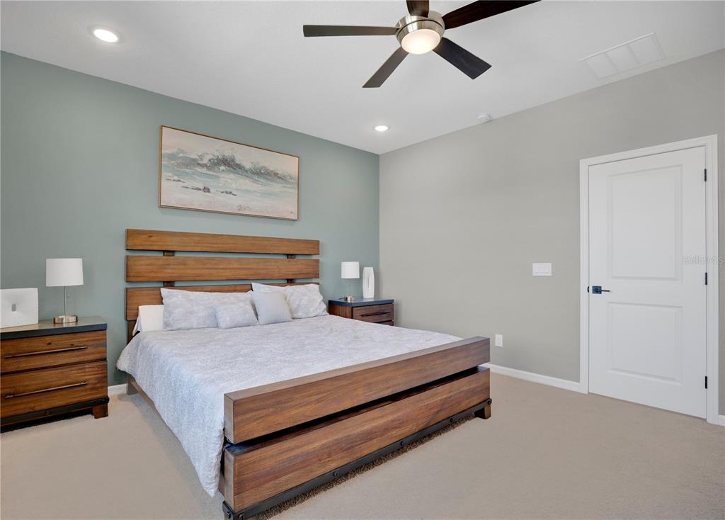 731 FIREROCK Lane DeBary, FL 32713 - Photo 12 of 39 a bedroom with a bed and painting on the wall