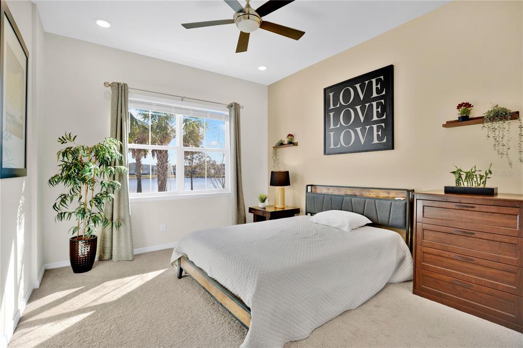 731 FIREROCK Lane DeBary, FL 32713 - Photo 16 of 39 a bedroom with a bed and a potted plant