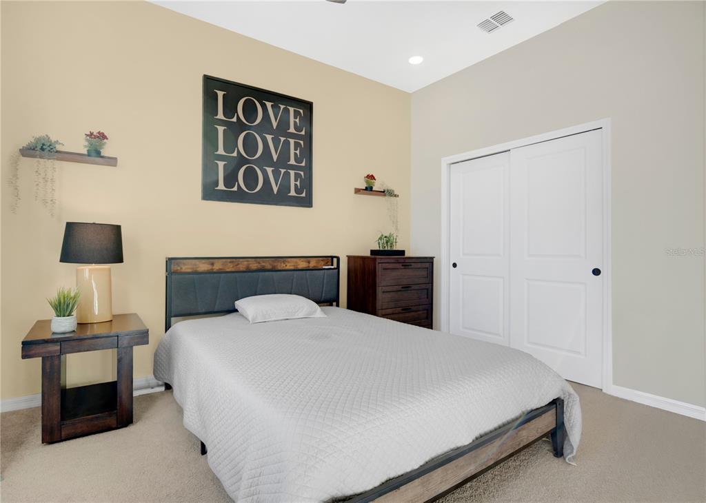 731 FIREROCK Lane DeBary, FL 32713 - Photo 17 of 39 a bedroom with a bed and a table