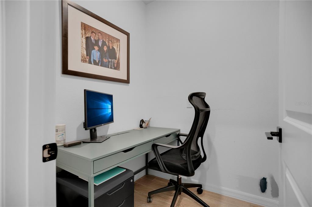 731 FIREROCK Lane DeBary, FL 32713 - Photo 22 of 39 a view of a workspace with furniture and a potted plant