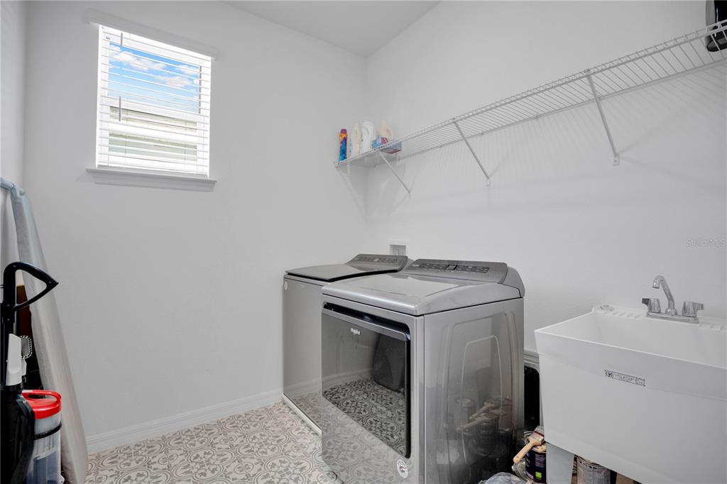 731 FIREROCK Lane DeBary, FL 32713 - Photo 23 of 39 a utility room with dryer and washer