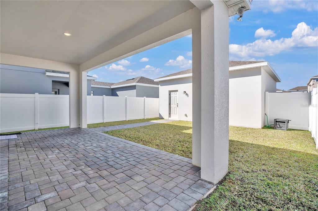 731 FIREROCK Lane DeBary, FL 32713 - Photo 25 of 39 a view of a big room with a fireplace and a chandelier